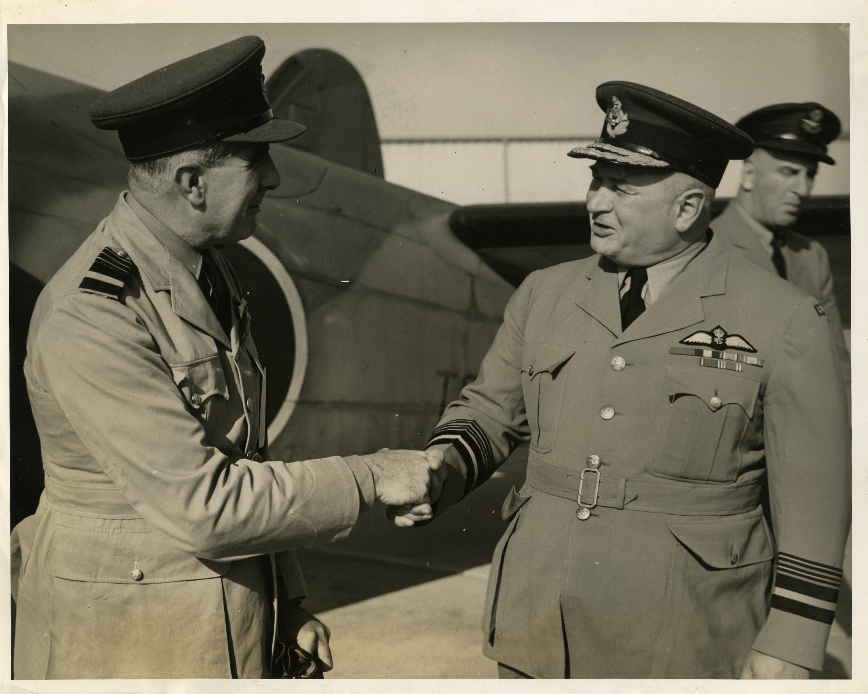 ACM Sir Christopher Courtney being greeted at RCAF Rockcliffe by AM L S Breadner, Chief of the Air Staff, RCAF