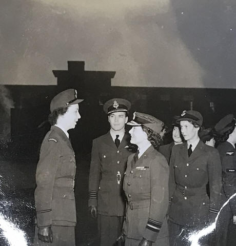 HRH the Duchess of Gloucester CI, CBE talking to SO V E Trotter, Gp Capt D M Edwards, the Station Commander, is in the background
