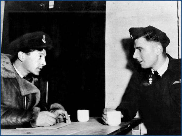 Clive Stinton with Charles Appleton during a post raid debriefing.